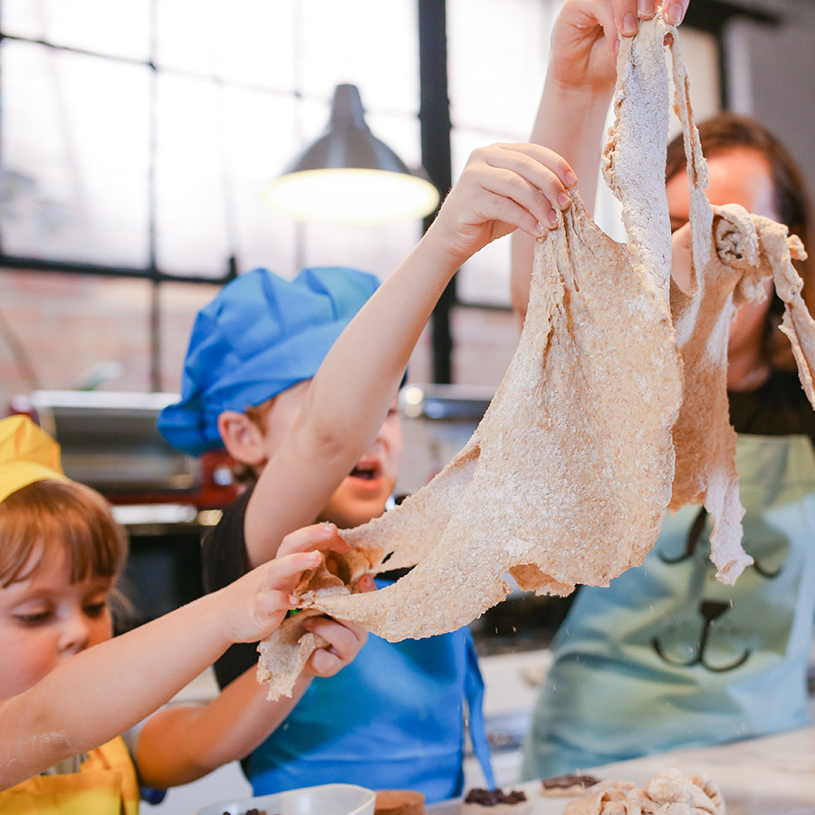family enjoying a sticky fingers cooking private online cooking class